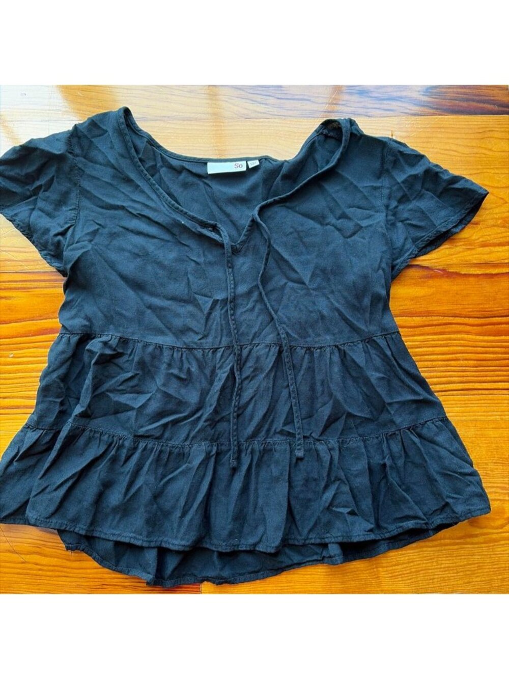Black baby doll ruffled blouse with button-up front and short